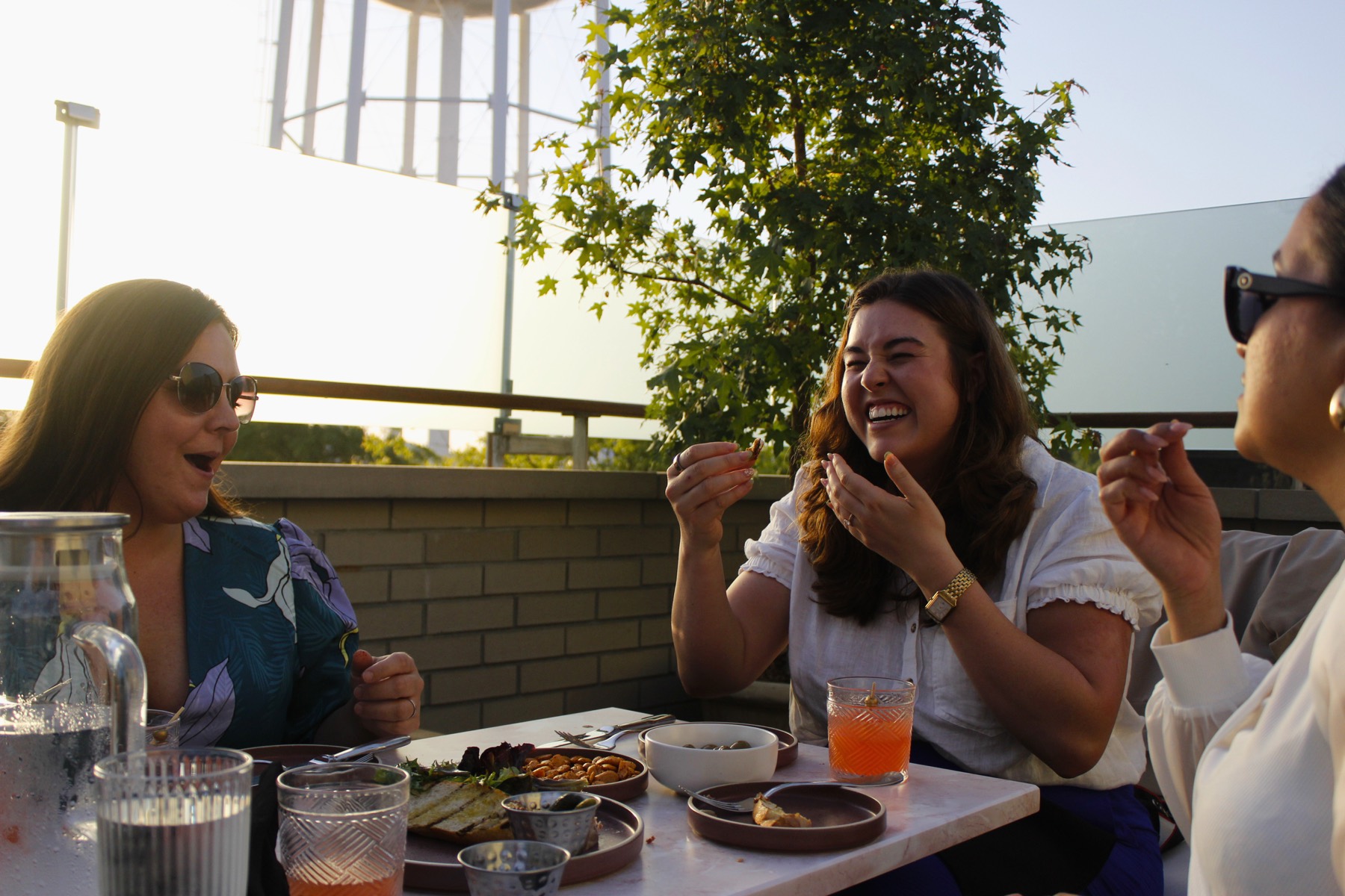 Guests laughing at the Celeste influencer night on the rooftop