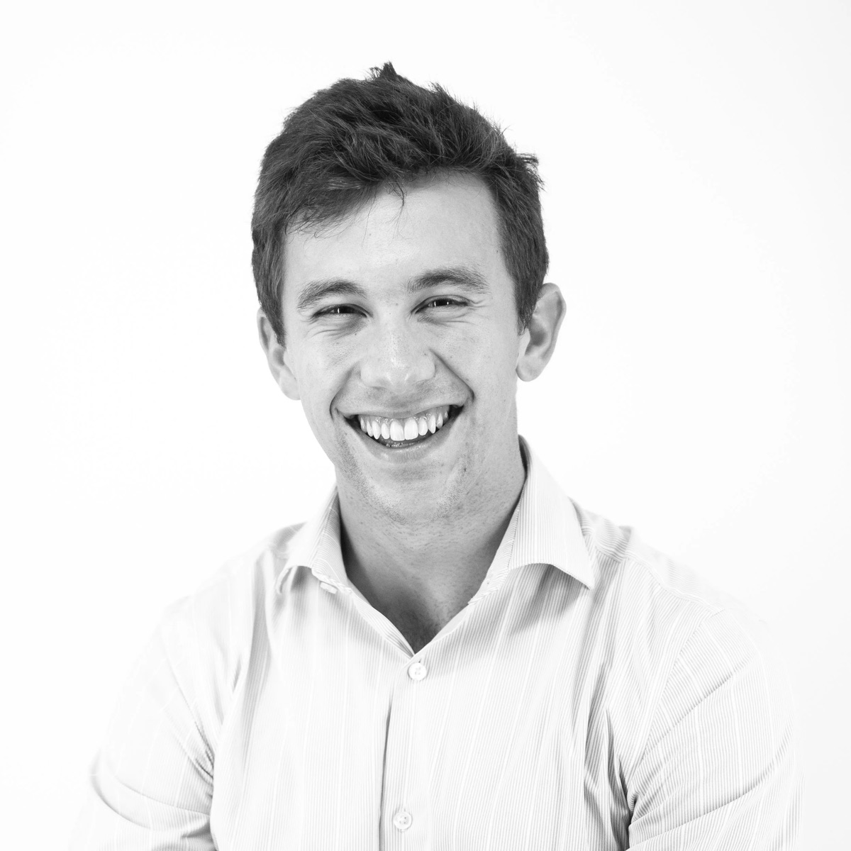 Black and white portrait of Donovan Fiore smiling